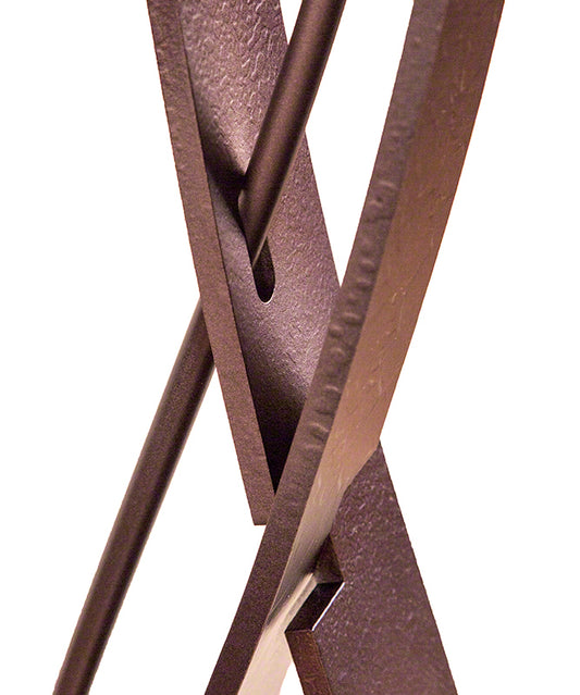 Almost Infinity Floor Lamp by Hubbardton Forge with intersecting matte mahogany rods, showcasing its sculptural design.