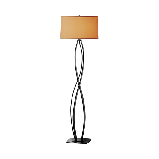 Almost Infinity Floor Lamp by Hubbardton Forge with black wrought iron base and beige drum shade, showcasing elegant American craftsmanship.