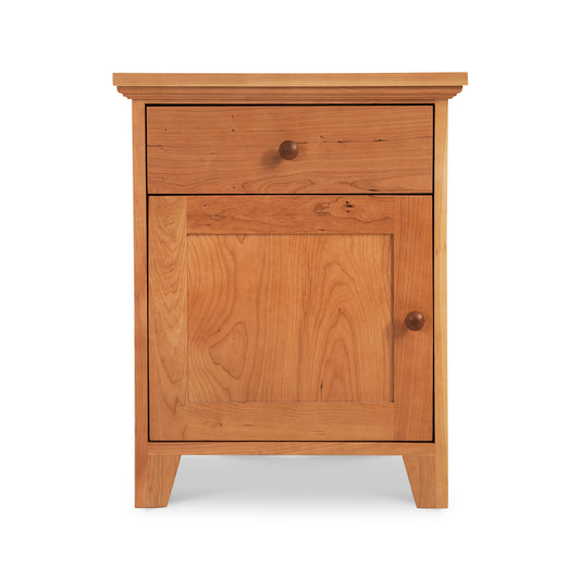 Handcrafted solid wood nightstand with drawer, door, and round handles in classic American Country style by Lyndon Furniture.