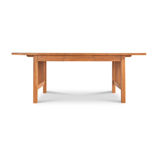 Lyndon's American Mission Extension table with a natural finish, featuring slatted sides and a flat top.
