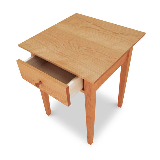 American Shaker 1-Drawer Nightstand by Maple Corner Woodworks, crafted from solid hardwoods with a classic design featuring four legs and an open drawer.