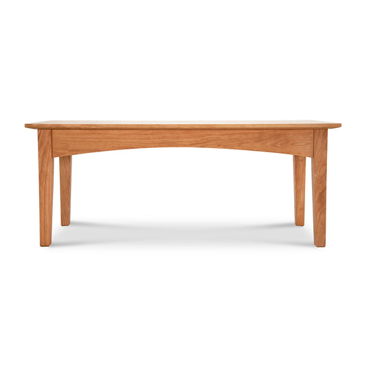 American Shaker Coffee Table by Maple Corner Woodworks with a handcrafted light brown finish, featuring solid hardwood construction, sturdy legs, and a smooth rectangular top, side view.