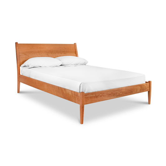 Andover Modern Incline Bed featuring a solid wood frame and minimalist headboard, paired with a white mattress and plush pillows for a sleek platform bed experience.