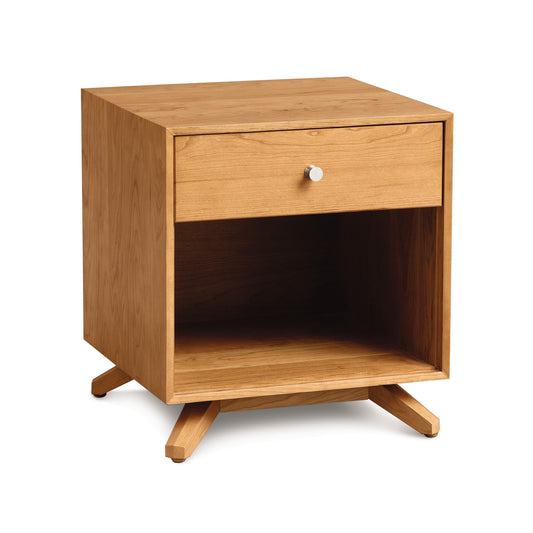 Copeland Astrid Nightstand in solid wood featuring a drawer, shelf, angled legs, and a round silver knob.