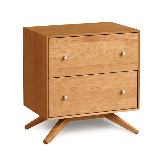 Copeland Furniture Astrid Nightstand showcasing Scandinavian design, silver knobs, splayed legs, and a pristine white finish.