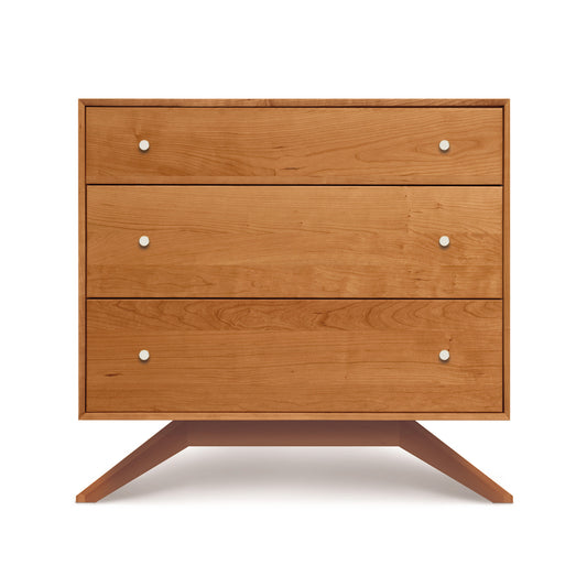 Astrid 3-Drawer Chest by Copeland Furniture in solid hardwood with a Mid Century Modern design, featuring three drawers and distinctive angled legs.