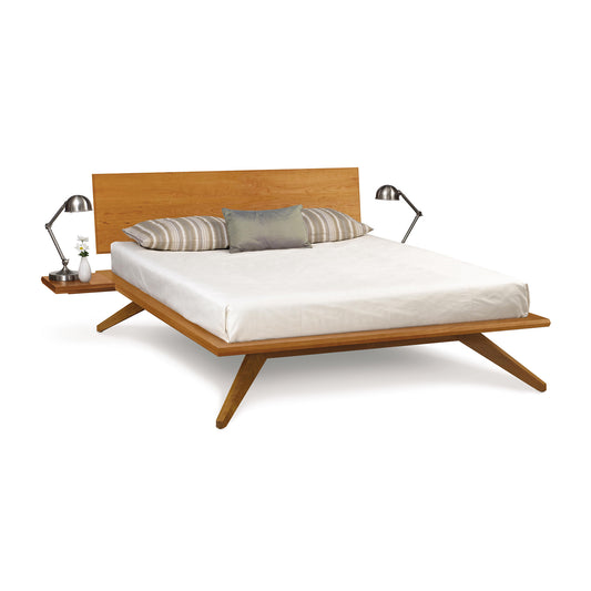 Astrid Platform Bed by Copeland, mid-century modern style, features a slanted headboard crafted from eco-friendly wood.