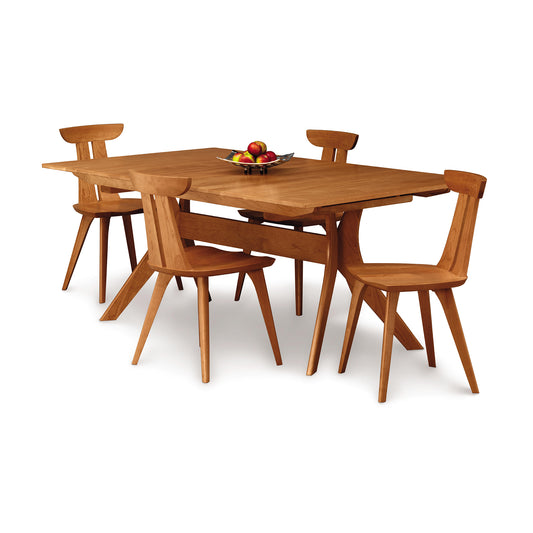 Audrey Extension Dining Table by Copeland Furniture with four matching chairs, featuring a sleek, modern design and smooth wooden finish.