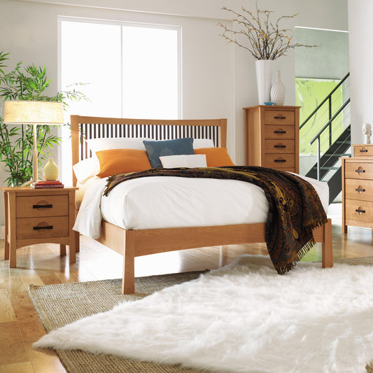 Copeland Furniture Berkeley Cherry Platform Bed with white bedding and orange pillows, paired with matching nightstands.