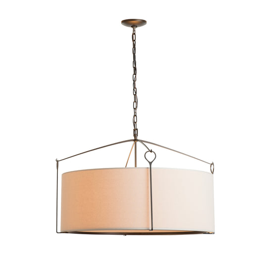 Large Bow Pendant by Hubbardton Forge with handmade beige fabric shade and metal frame suspended by chain.