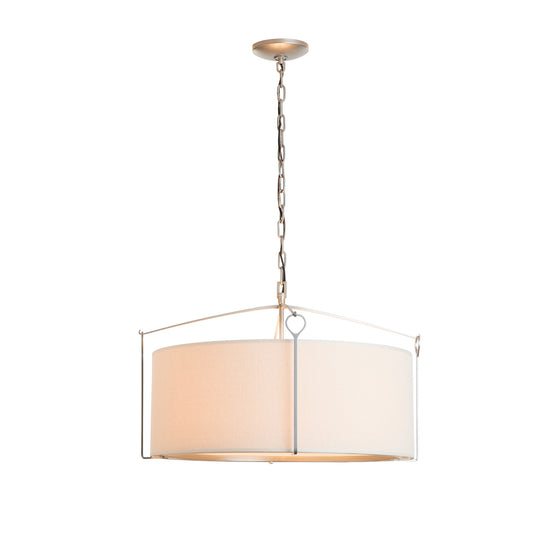 Hubbardton Forge Bow Pendant: circular beige fabric shade with metal casing, featured in a sleek design suspended by a chain and rod.