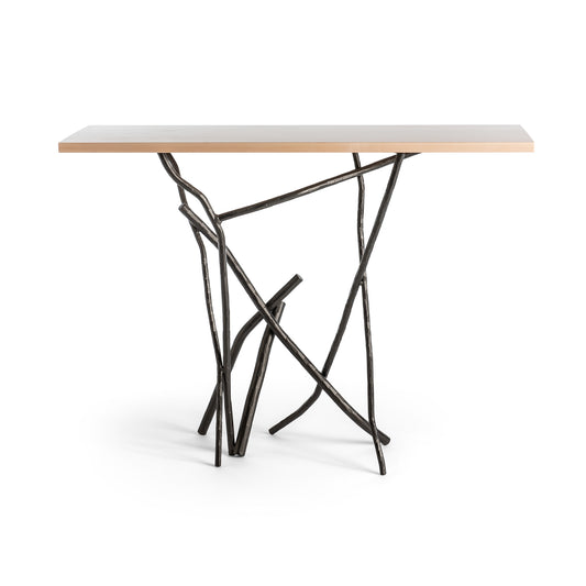 Brindille Console Table by Hubbardton Forge with a Vermont Maple top and unique artistic metal legs resembling intertwined branches.