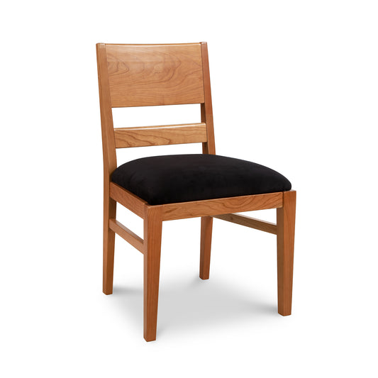 Burke Modern Chair by Vermont Woods Studios, showcasing Scandinavian design with black cushioned seat and natural wood backrest.