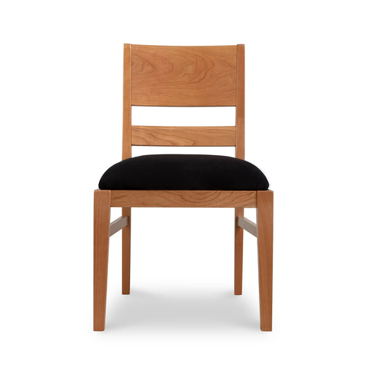 Burke Modern Chair by Vermont Woods Studios crafted from natural wood with a black cushioned seat and dual slats.