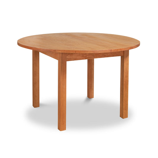 Burlington Shaker Round Solid Top Dining Table by Vermont Furniture Designs featuring four straight legs.