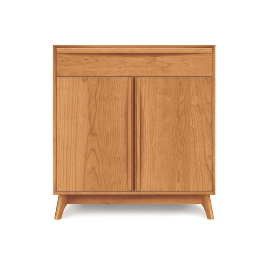 Catalina 1-Drawer, 2-Door Buffet by Copeland Furniture showcases mid-century style with light wood finish and angled legs.