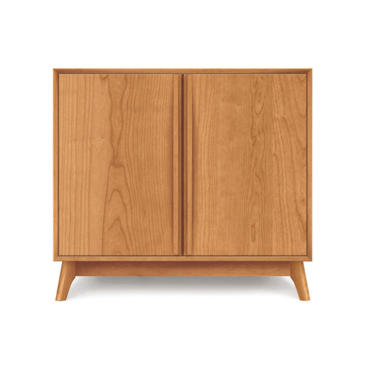 Catalina 2-Door Buffet by Copeland Furniture featuring a sleek, rectangular wood design with signature angled legs.