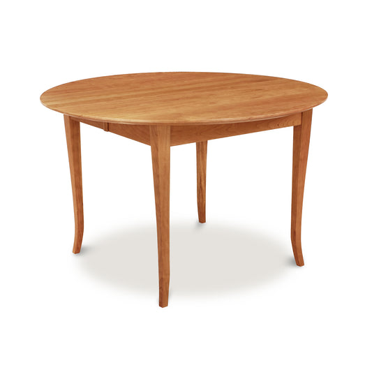 Classic Shaker Flare Leg Round Extension Table by Lyndon Furniture, featuring elegant curved legs and smooth wood finish.