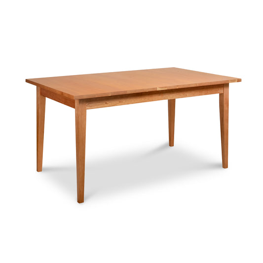 Lyndon Furniture Classic Shaker Solid Top Dining Table in solid wood with a light brown finish, highlighting craftsmanship and elegant shaker design.