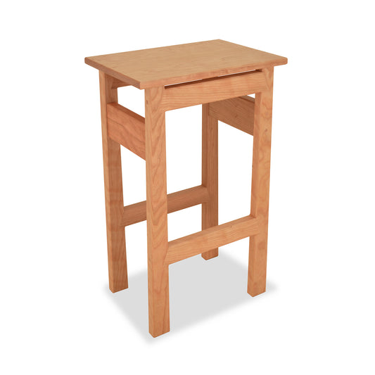 Contemporary Asian Stool by Maple Corner Woodworks with a rectangular seat and four sturdy legs in a natural wood finish.