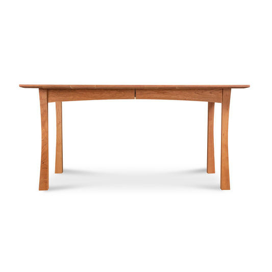 Contemporary Craftsman Extension Dining Table with smooth top and elegant curved legs, crafted by Vermont Furniture Designs, showcased prominently.
