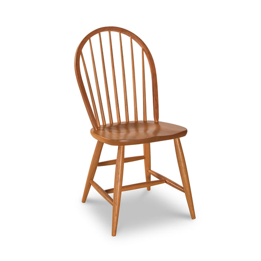 Contemporary Windsor Chair by Lyndon Furniture in solid cherry wood with rounded slatted backrest and simple legs.