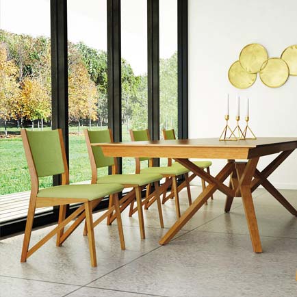 A dining room with a wooden table and chairs.