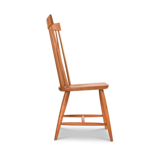 Lyndon Furniture Country Windsor Chair in natural cherry, featuring a high backrest and vertical slats, showcased from the side.