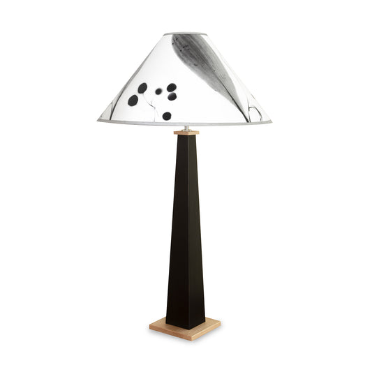 Dance of Life Table Lamp by Rock River Studio with a black tapered base and a conical shade featuring abstract black and gray patterns.
