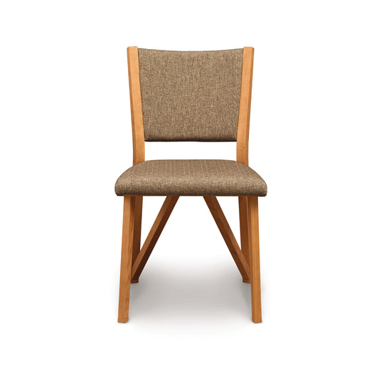 Exeter Chair by Copeland Furniture with modern silhouette, light brown legs, and textured brown upholstery, showcasing fine American craftsmanship.