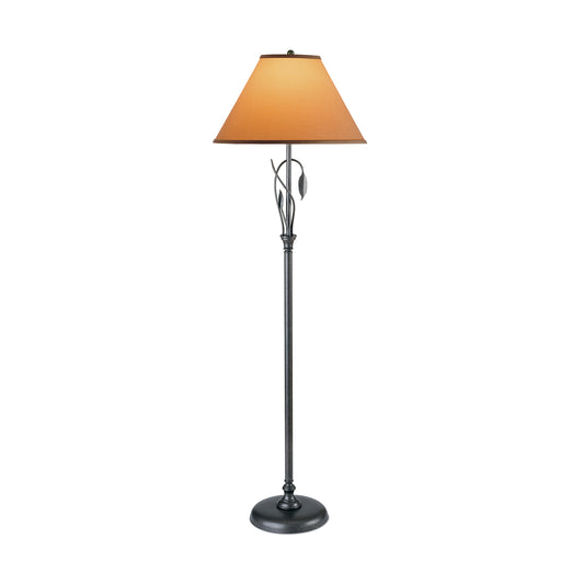 Hubbardton Forge Forged Leaves and Vase Floor Lamp with black metal base, decorative leaf accents, and wide brown conical lampshade.