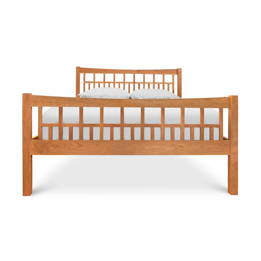 Glastenbury Platform Bed by Vermont Furniture Designs, featuring a solid wood construction with Arts and Crafts style slatted headboard and footboard.