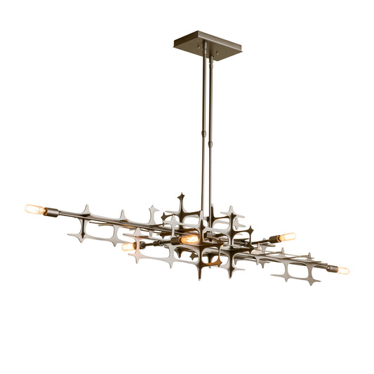 Geometric metal frame of the Hubbardton Forge Grid Pendant with exposed bulbs, highlighting its industrial design.