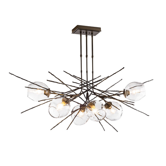 Modern Griffin Pendant chandelier featuring hand-forged steel rods and hand-blown glass bulbs by Hubbardton Forge.