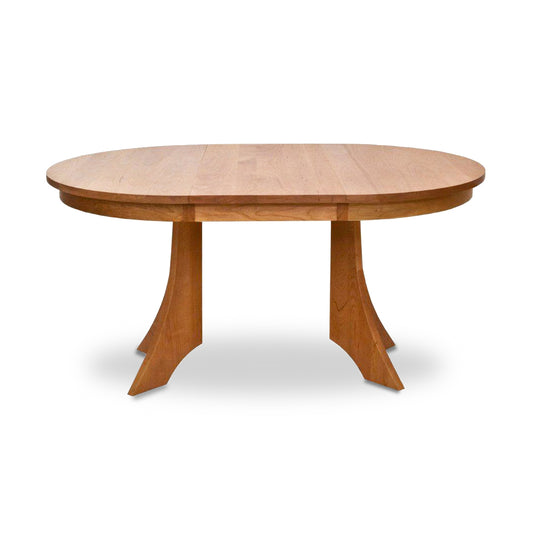 Hampton Split Pedestal Extension Table by Lyndon Furniture with an oval top and distinctive two-legged base, crafted from quality wood.