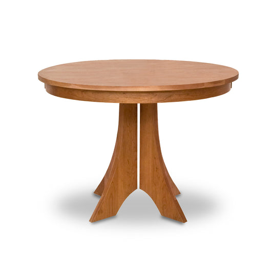 Hampton Split Pedestal Round Table by Lyndon Furniture with a round top and four curved legs, crafted in quality wood.