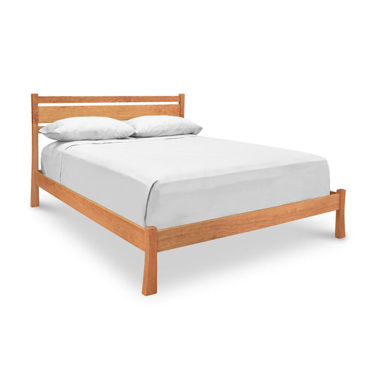 Horizon Platform Bed by Vermont Furniture Designs featuring a minimalist headboard, showcasing a white mattress and two white pillows.