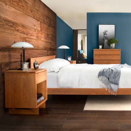 Wooden bed with matching side tables and a dresser, featuring high-quality craftsmanship and American-made design.