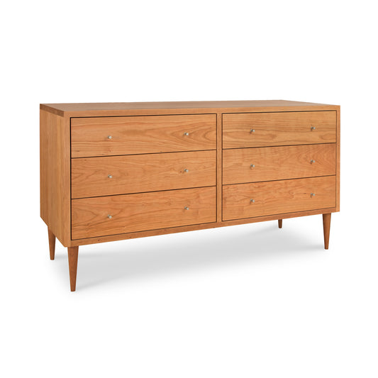 Larssen 6-Drawer Dresser by Vermont Furniture Designs showcases a mid-century modern design with light finish, sleek tapered legs, and minimalist small knobs.