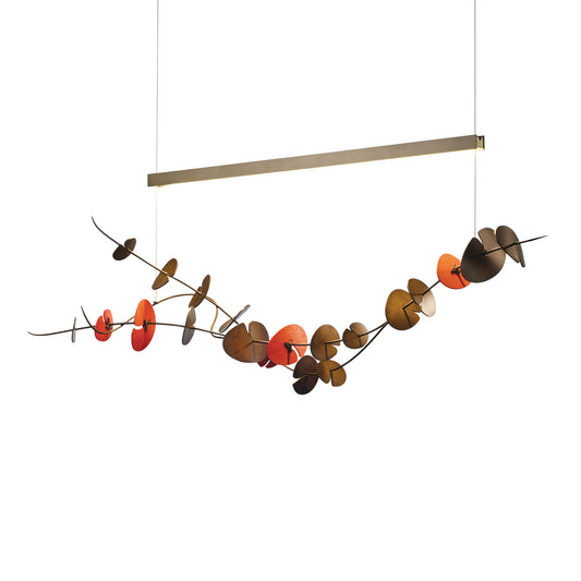 Hubbardton Forge Lily LED Pendant with a gold linear bar, sculpted branch accents, and colorful discs highlighting its modern, handcrafted design.