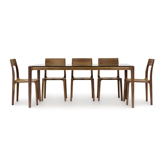 Lisse Glass Top Dining Table with 6 minimalist chairs by Copeland Furniture.