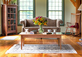 A living room with a couch and a coffee table.