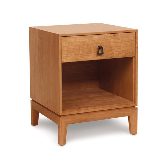 Solid wood Mansfield Nightstand by Copeland Furniture featuring angled legs, a drawer, an enclosed shelf, and a metal handle.