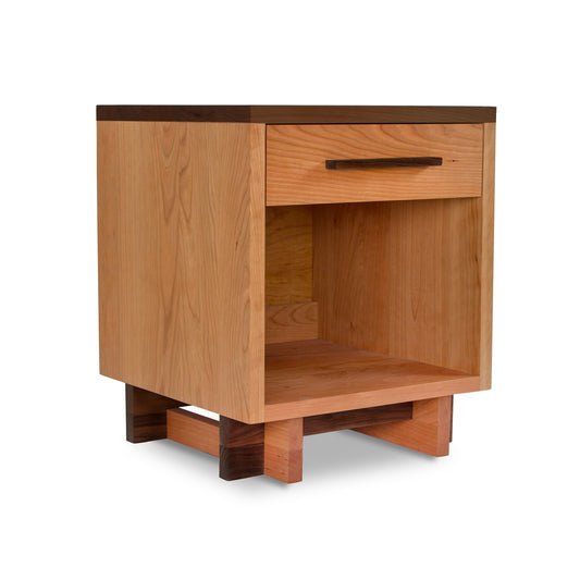 Modern American nightstand with 1 drawer and enclosed shelf, featuring short legs and prominent wood grain.