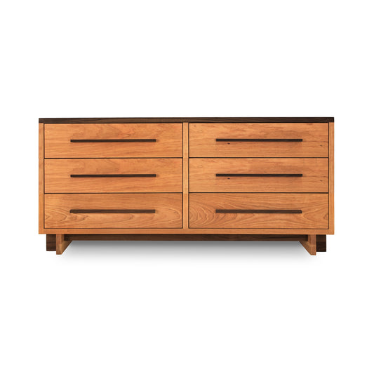 Vermont Furniture Designs Modern American 6-Drawer Dresser with light brown finish and dark handles.
