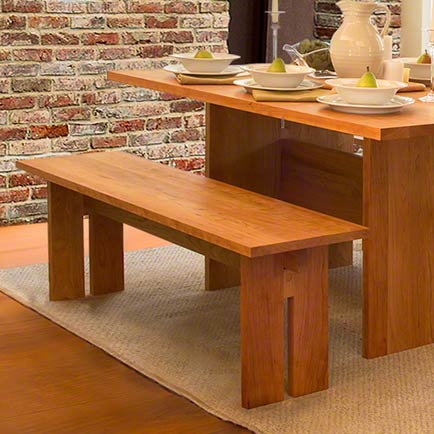A wooden table and chairs in a dining room.