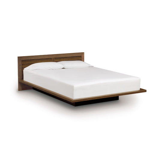 Copeland Furniture Moduluxe Platform Bed with Clapboard Headboard showcasing a meticulously crafted wooden frame and white mattress.