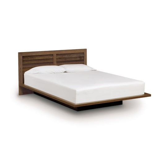 Copeland Moduluxe Platform Bed with Clapboard Headboard, 35" Series, crafted from sustainable wood, featuring a white mattress and pillows.