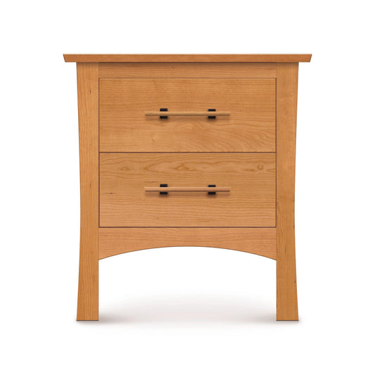 Solid cherry wood Monterey Nightstand by Copeland Furniture with two drawers, black handles, flat top, and gracefully curved legs.