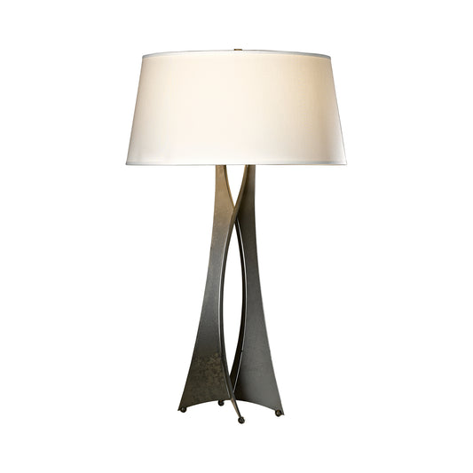 Twisted wrought iron base with a wide cylindrical white shade of the Moreau Table Lamp by Hubbardton Forge.